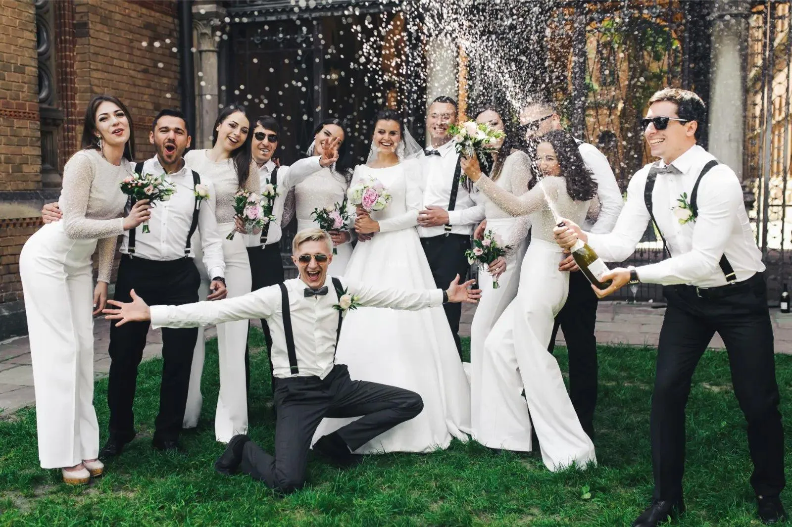 Wedding party celebrating with champagne